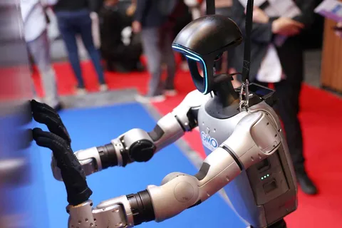 Humanoid robots strut their stuff as trade show comes to Japan