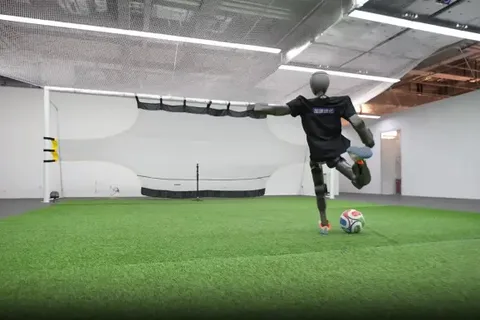 Robot soccer player that will likely render humans obsolete kicks ball so hard it dents wall